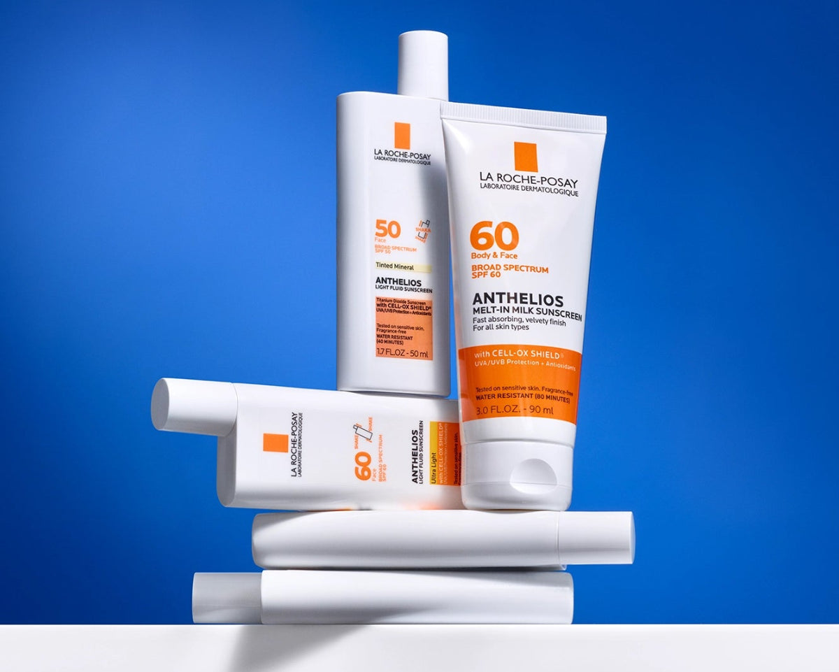 Collection of La Roche-Posay sunscreen products on a blue background