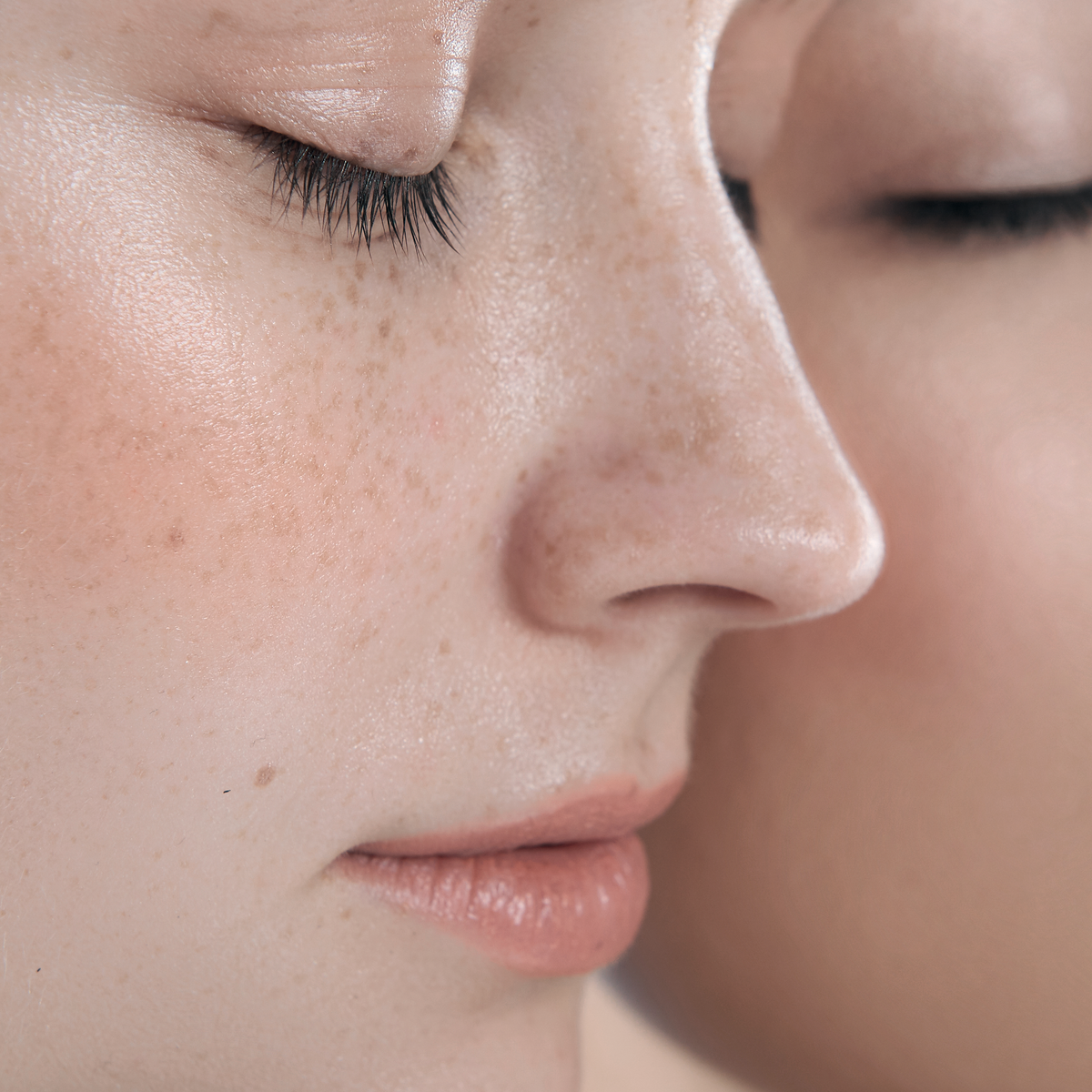A-Derma Protect, close-up of a freckled face with closed eyes
