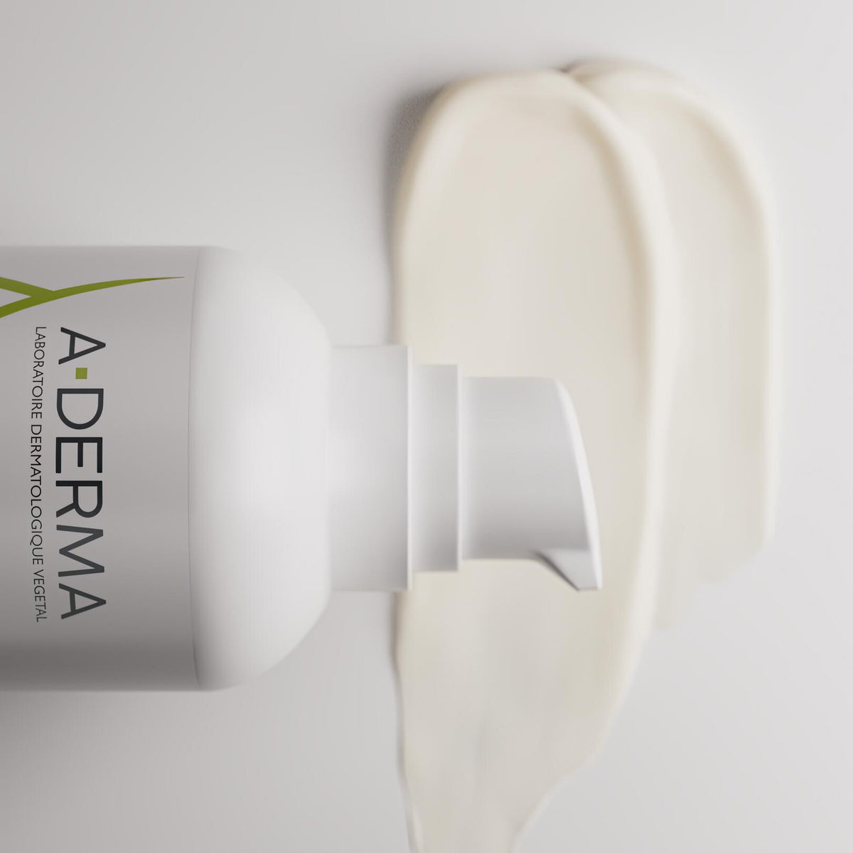 A-Derma Exomega Control, pump bottle lying beside a cream swatch