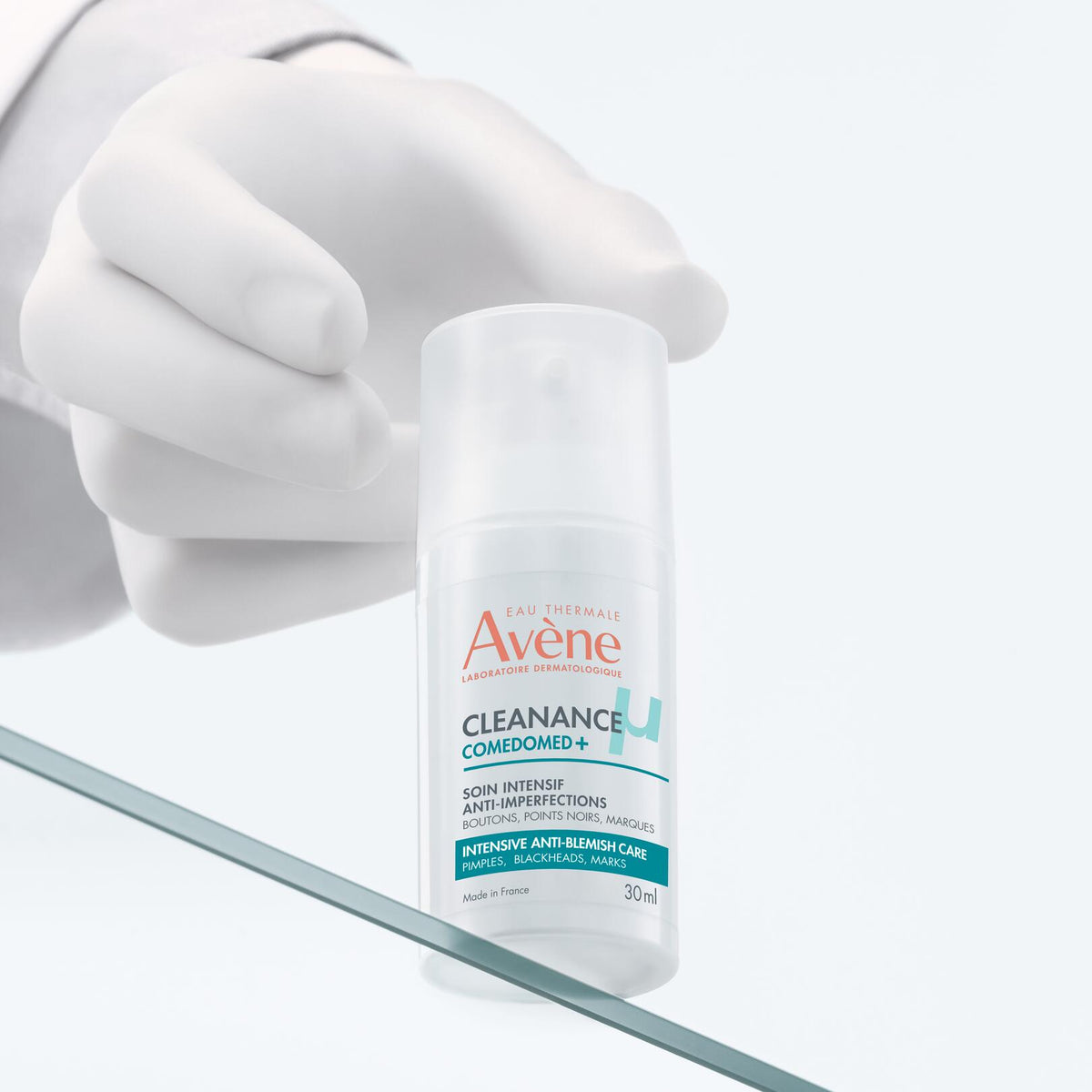 Avène Cleanance, hand setting the pump bottle on a glass shelf