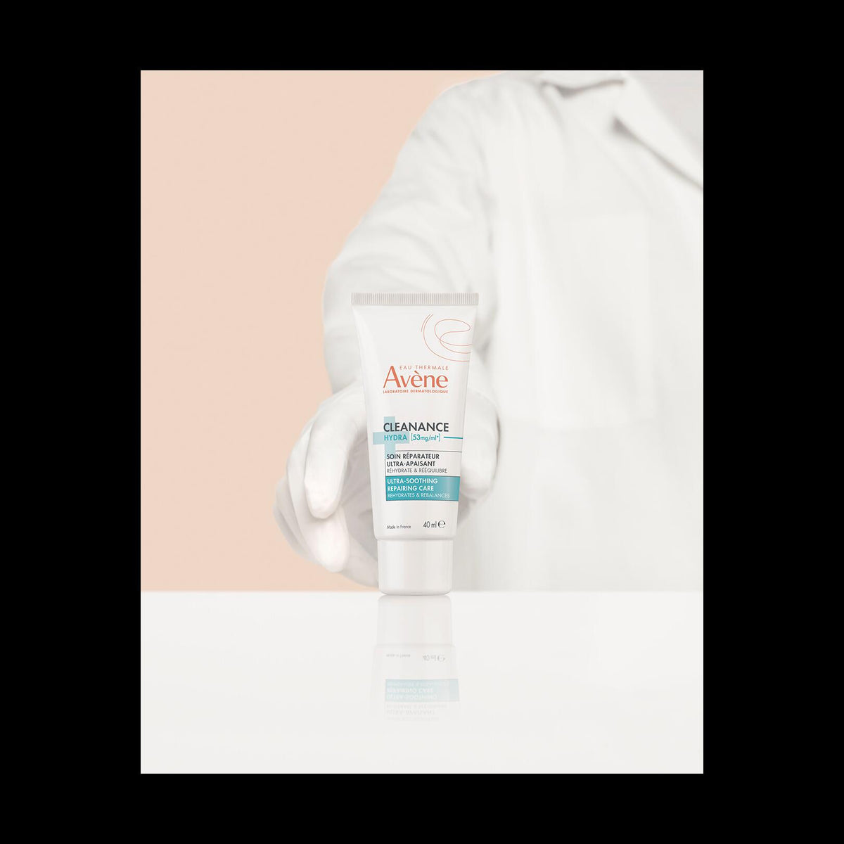 Avène Cleanance, gloved hand in a lab coat holding the tube