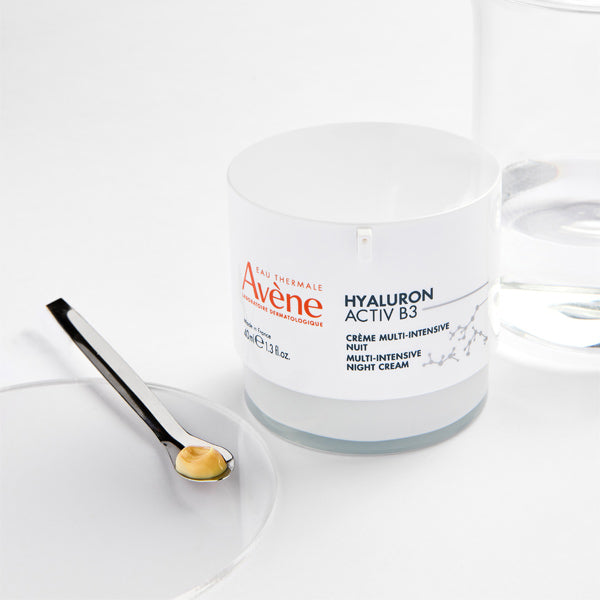 Avène Hyaluron Activ B3, jar with a spatula of cream on a glass dish