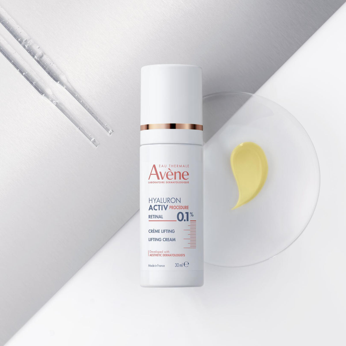 Avène Hyaluron Activ, pump bottle beside a glass dish with a cream swatch