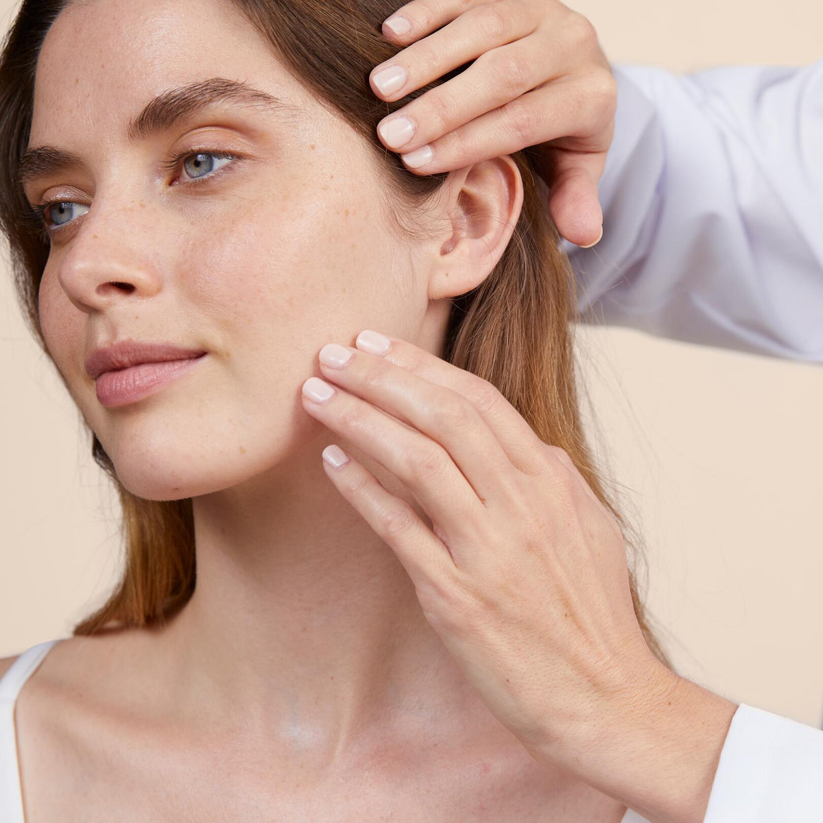 Avène Hydrance Boost, close-up of a woman touching her cheek