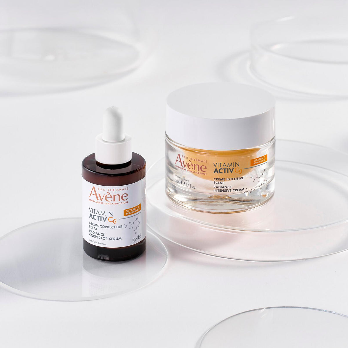 Avène Vitamin Activ Cg, glass bottle beside the Intensive Radiance Cream jar