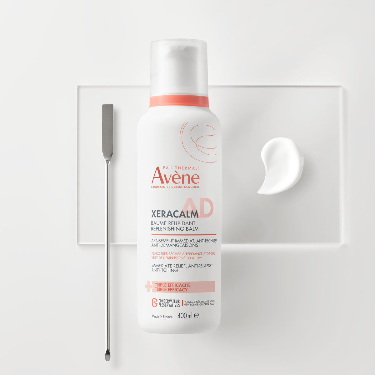 Avène XeraCalm A.D Lipid-Replenishing Balm 400ml, pump bottle with a swatch of the balm texture