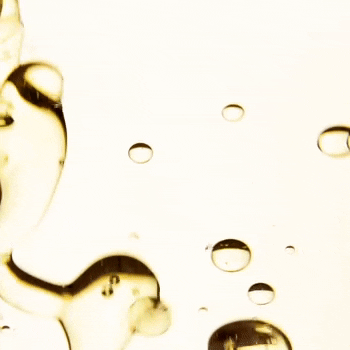 Bioderma Atoderm, close-up of oil drops on a pale background