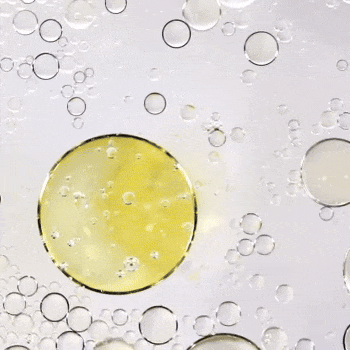 Bioderma Créaline AR+, yellow oil drop among clear bubbles