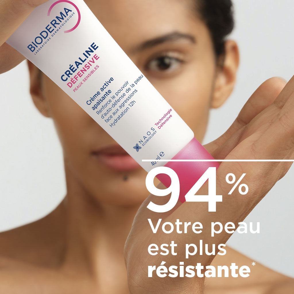 Bioderma Crealine Défensive, woman holding the tube with a study result in French