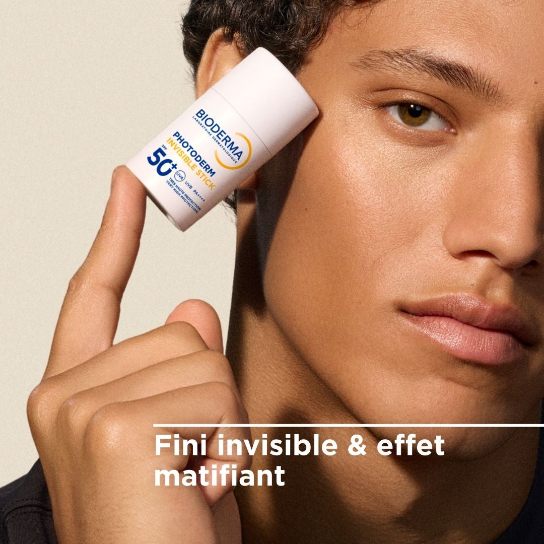 Bioderma Photoderm, man holding the stick by his face with text in French