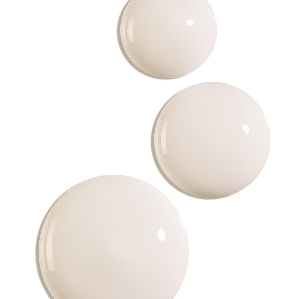 Bioderma Photoderm Spot-Age, three drops of gel-cream on a white background