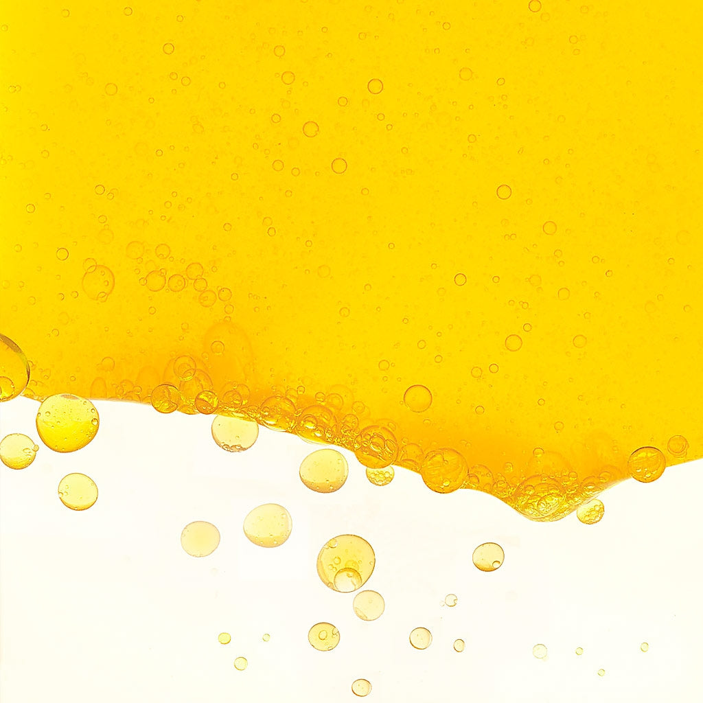 Bioderma Photoderm, yellow liquid wave with golden oil drops