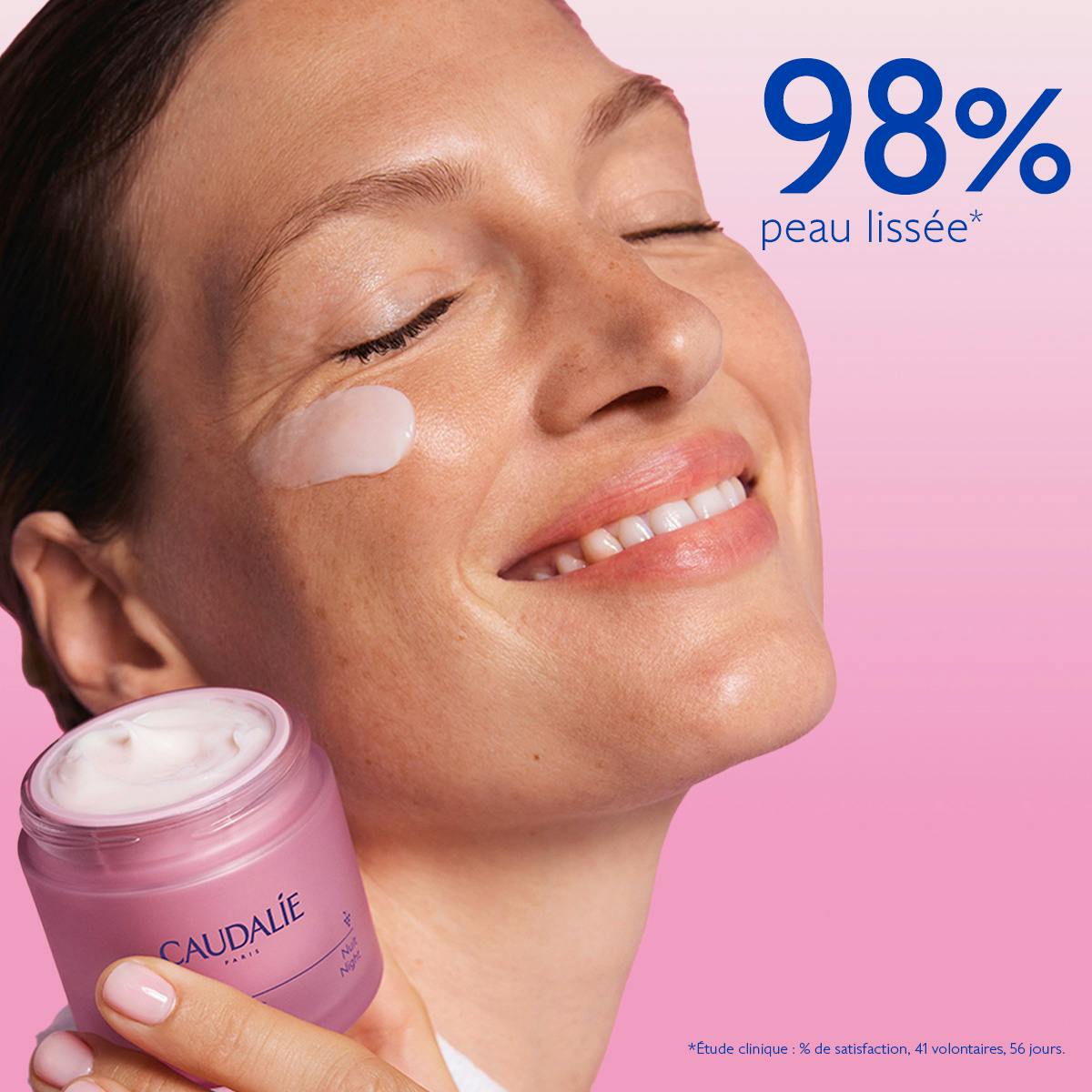 Caudalie Resveratrol-Lift, woman with eyes closed holding the open jar, cream on her cheek
