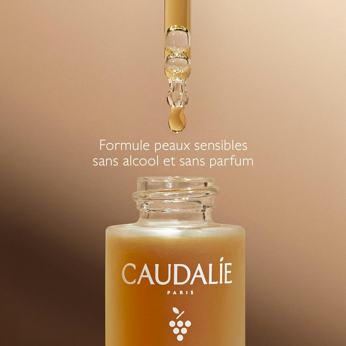 Caudalie Self-Tanning Sun Drops, dropper above the open glass bottle