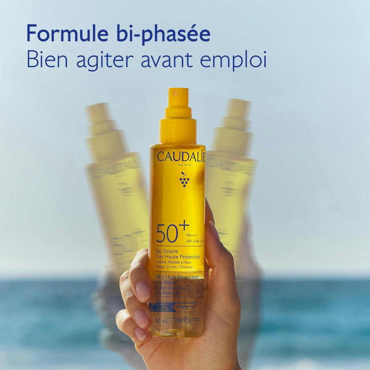 Caudalie Solaire, hand shaking the two-phase sun water bottle