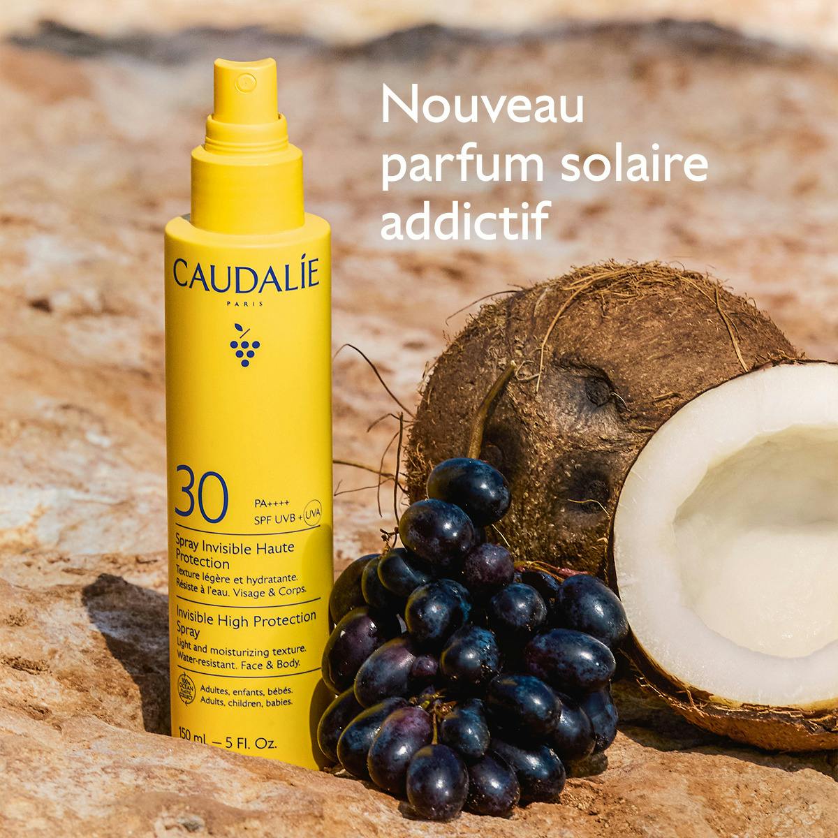 Caudalie Milky Sunscreen Spray, spray bottle with black grapes and a coconut