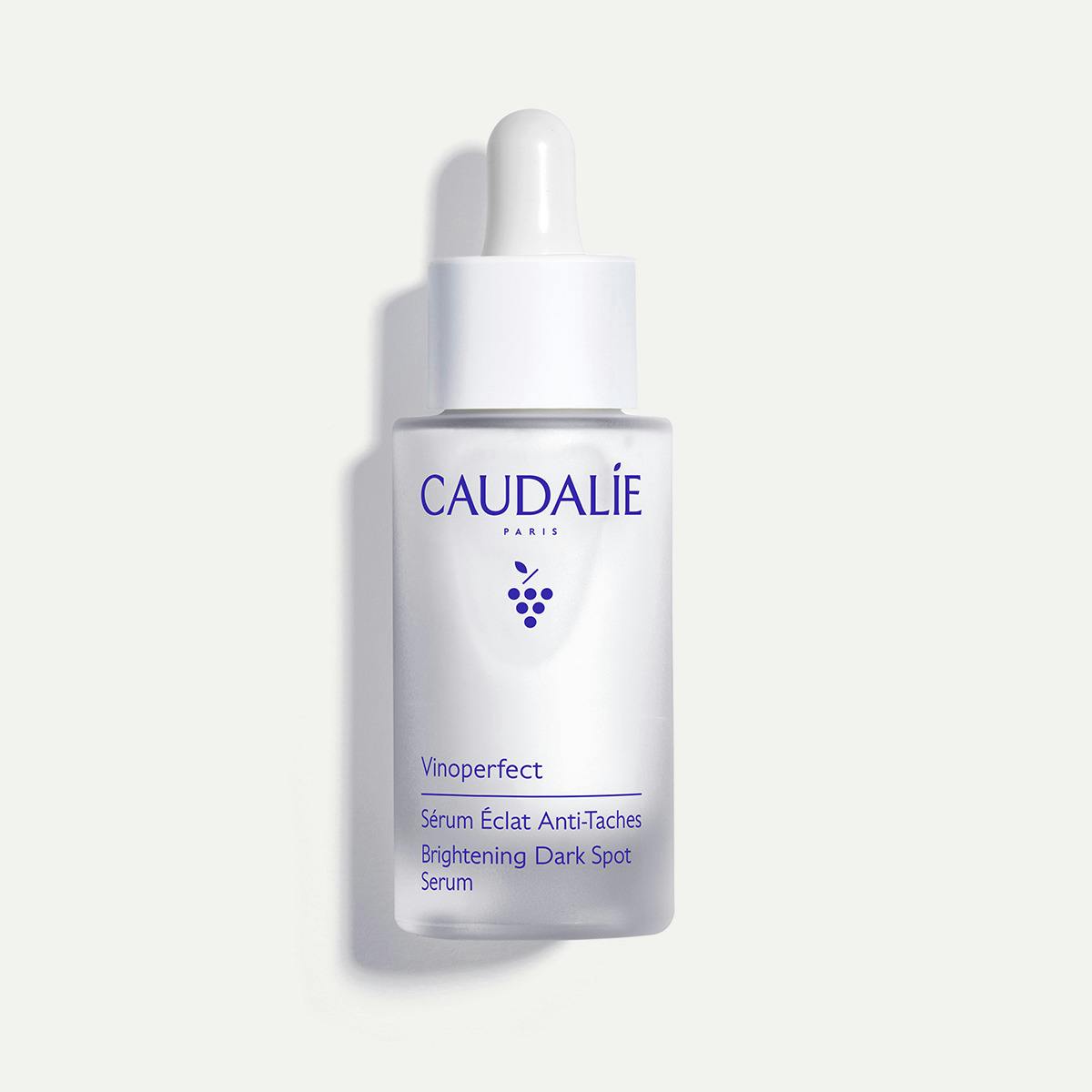 Caudalie Vinoperfect, glass dropper bottle on an off-white background