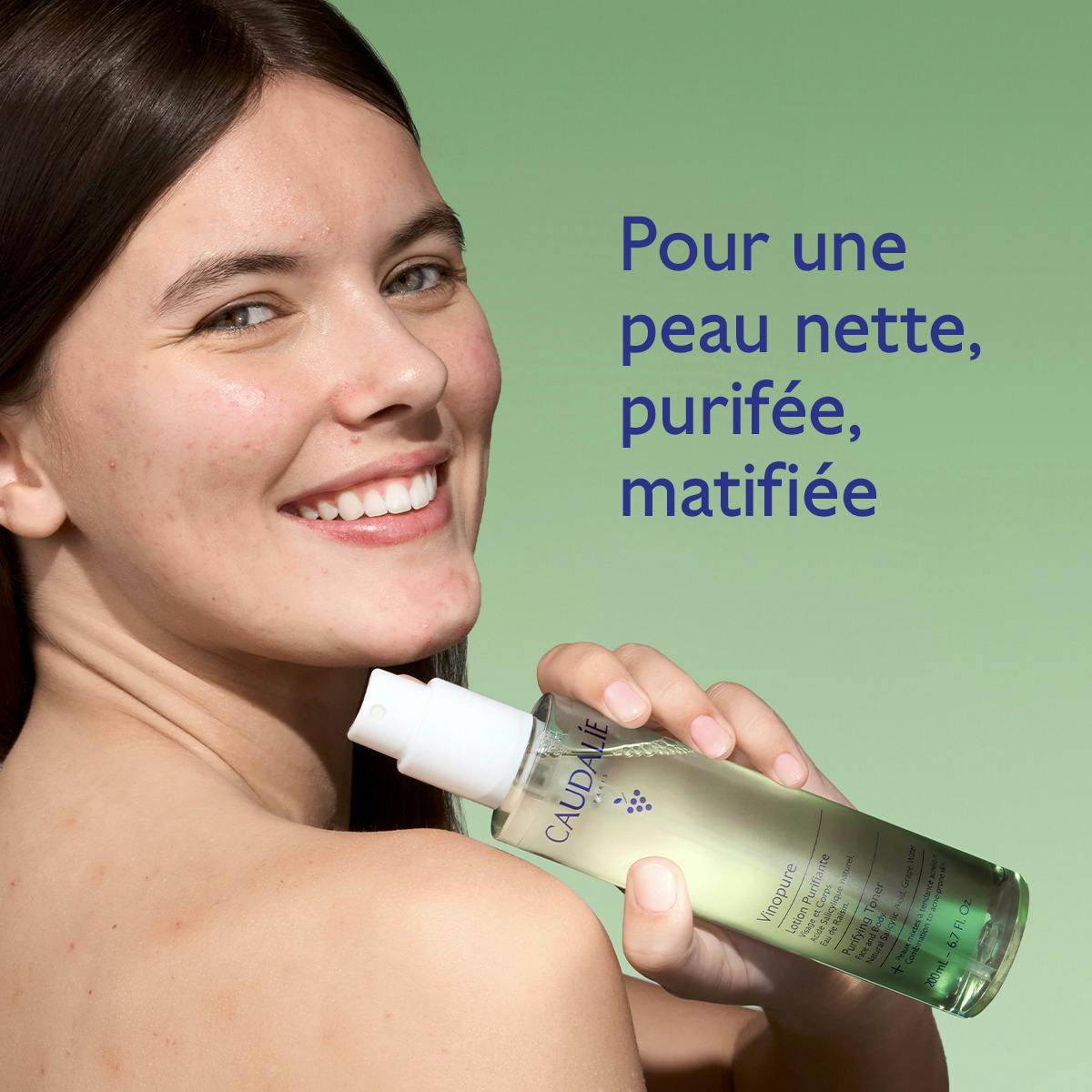 Caudalie Vinopure, smiling woman holding the spray bottle