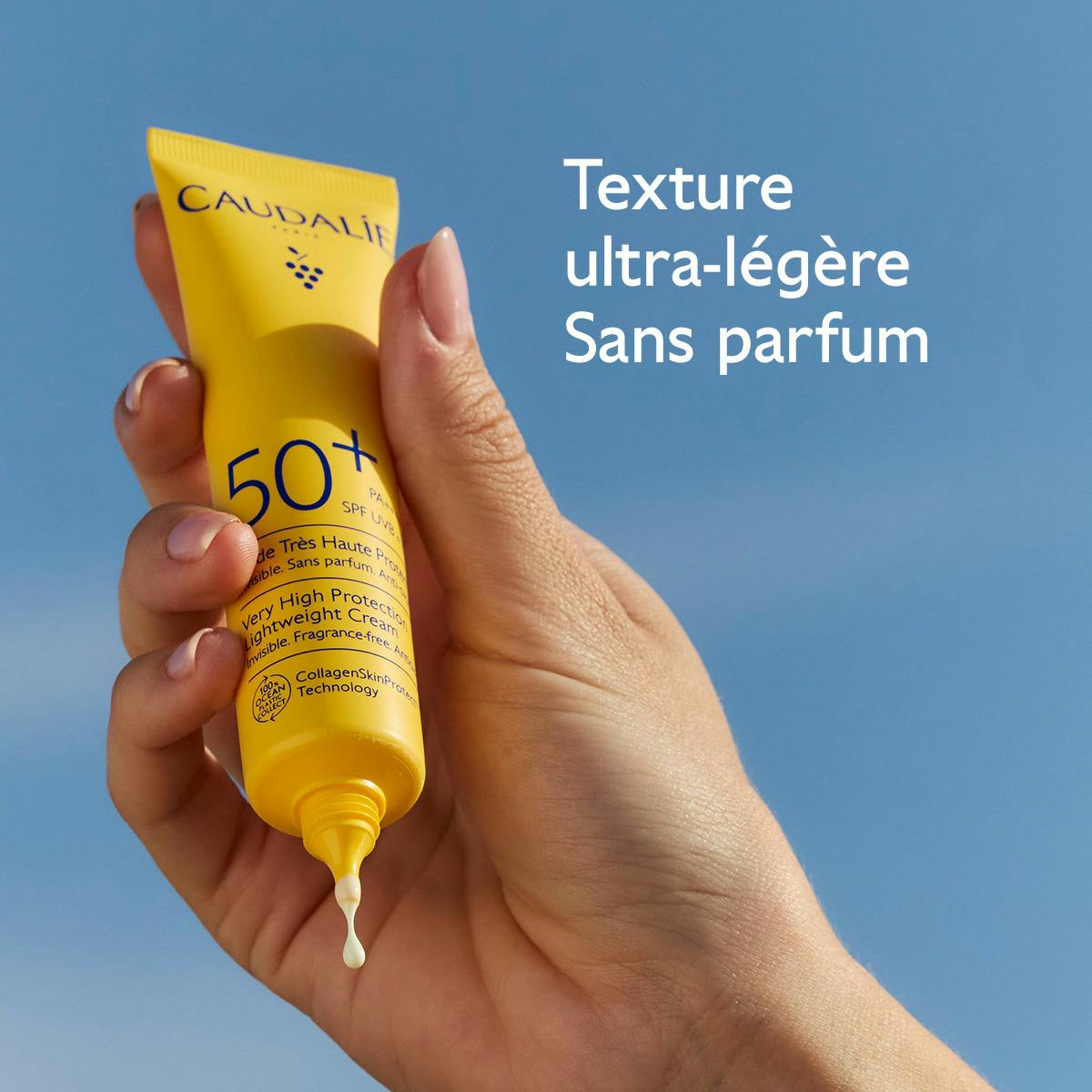 Caudalie Vinosun Protect, hand holding the tube with a drop of fluid