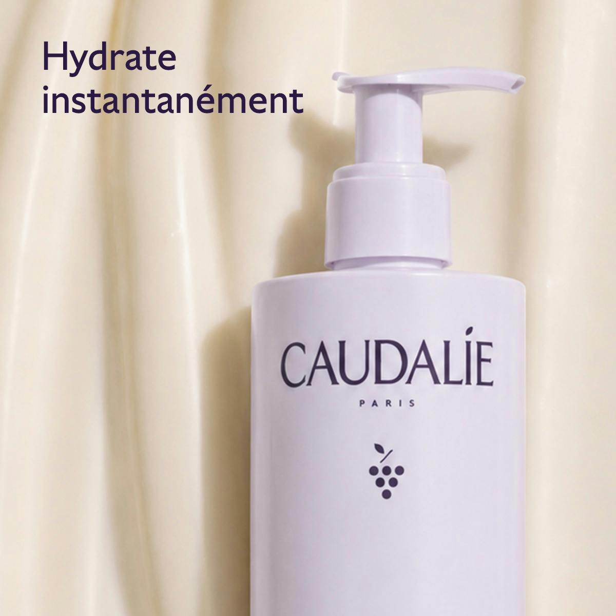 Caudalie Vinotherapist, pump bottle on a lotion swirl background