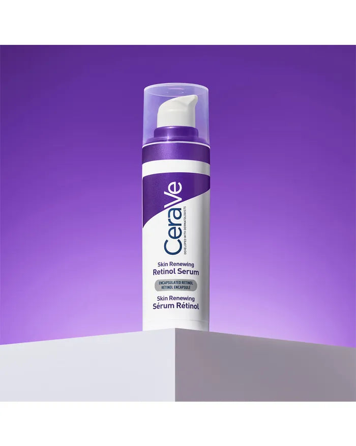 CeraVe Skin Renewing, pump bottle on a white stand against a purple backdrop
