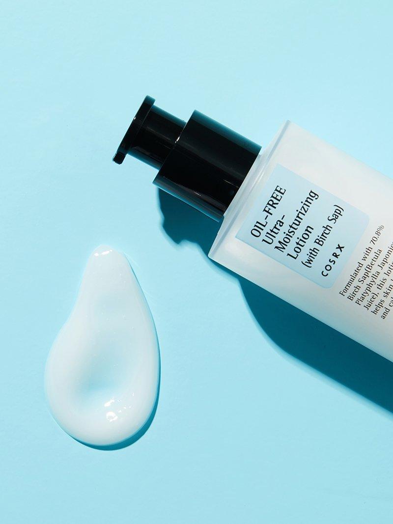 COSRX Oil-Free Ultra-Moisturizing Lotion, lotion swatch beside the bottle
