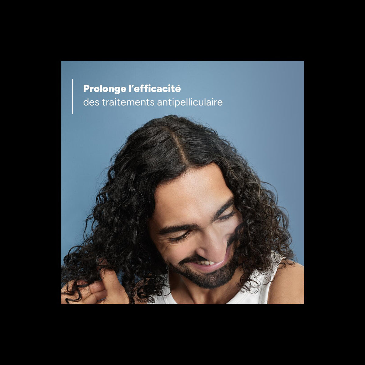 Ducray Elution, smiling man with long curly hair