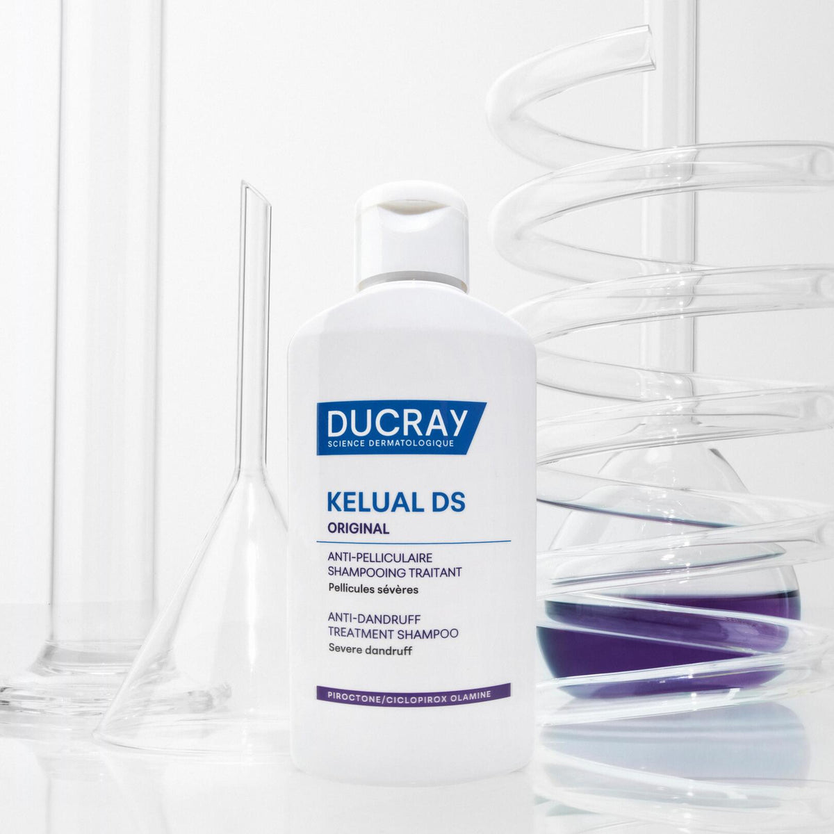 Ducray Kelual DS, bottle next to laboratory glassware