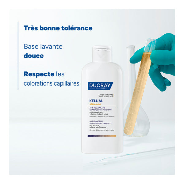 Ducray Squanorm, bottle and gloved hand holding a test tube, text in French