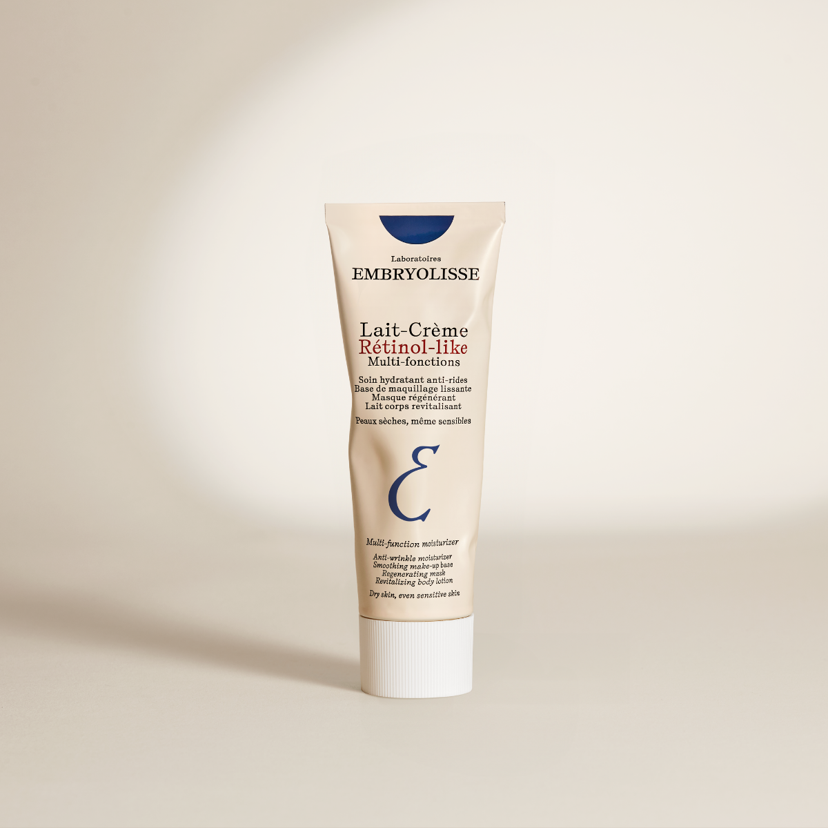 Embryolisse Retinol-Like Cream Milk, front of the tube on a beige background