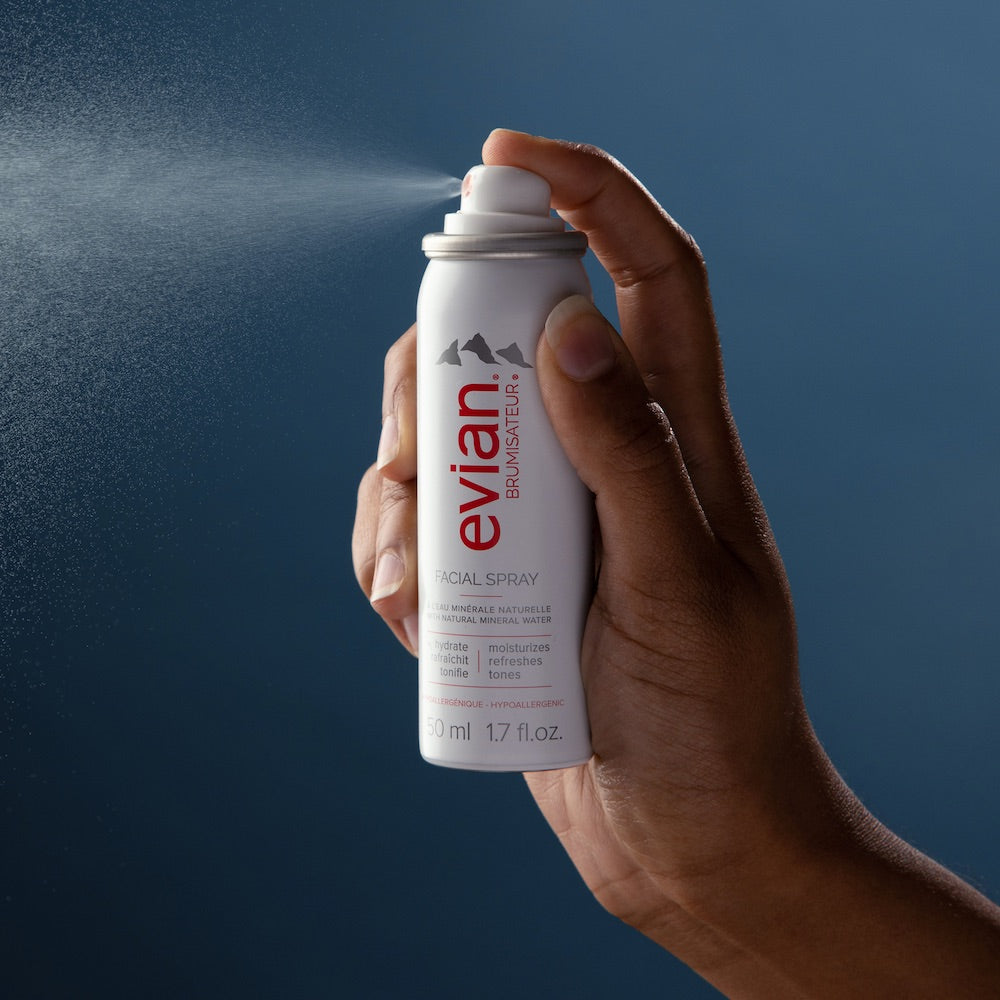Evian Facial Spray alpine mineral water mist aerosol can on white background, side view