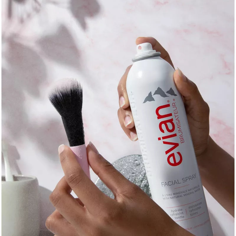 Evian Facial Spray alpine mineral water mist aerosol can on white background, product close-up