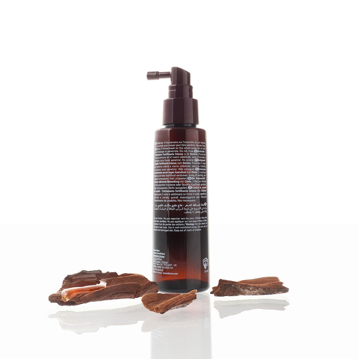 Klorane Fortifying Serum, back of the spray bottle among quinine bark pieces