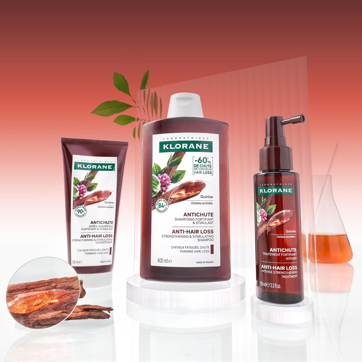 Klorane Fortifying Serum, range of three products on a red background