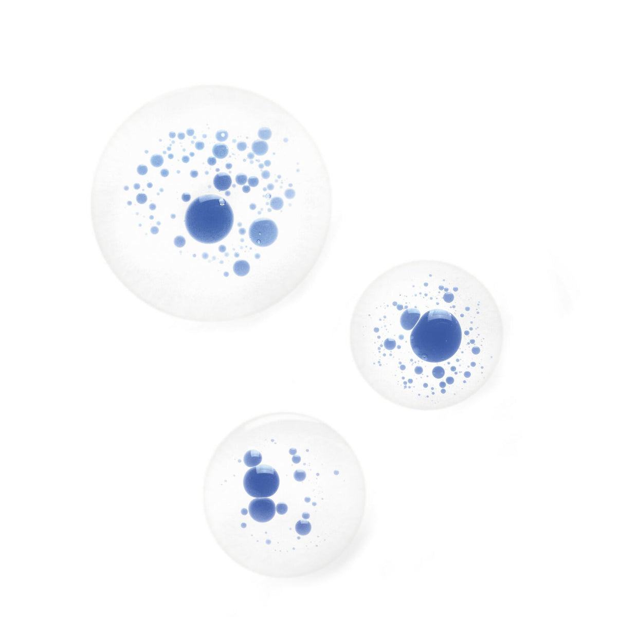 Klorane Cornflower, blue and clear two-phase droplets on a white background