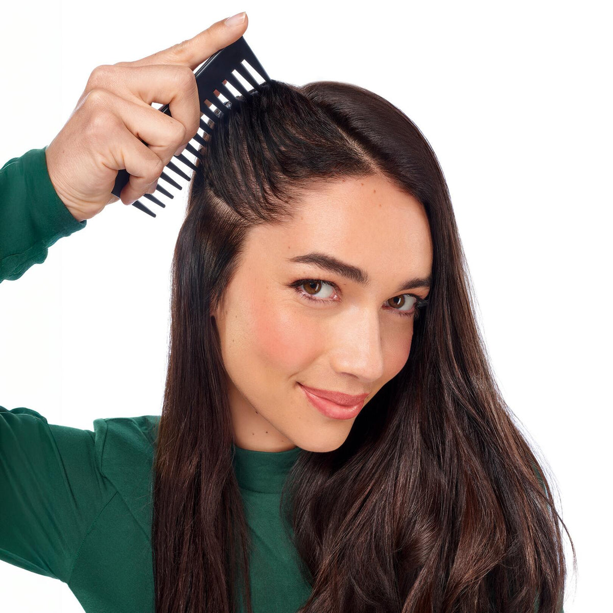 Klorane Galanga, woman parting her hair with a comb