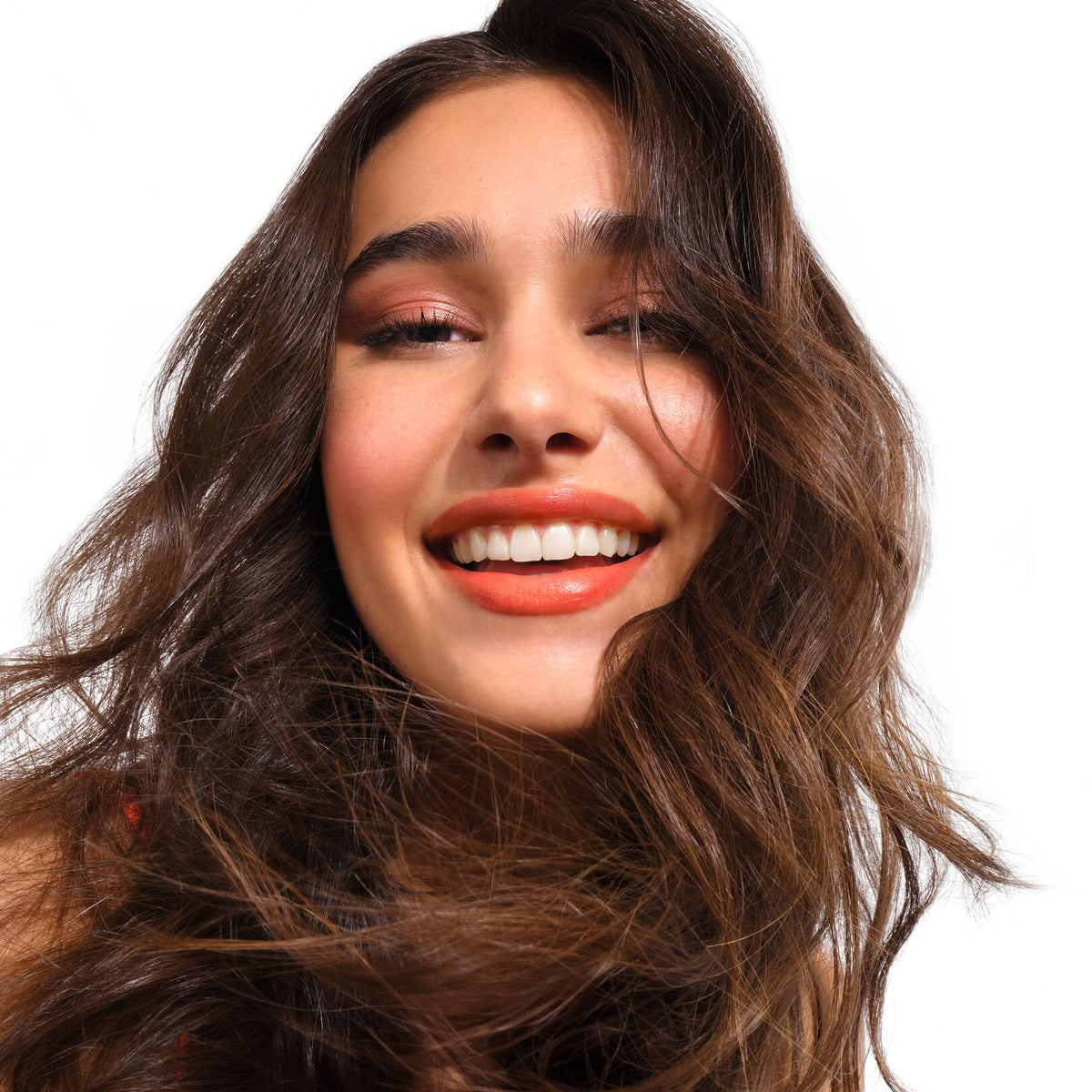 Klorane Mango, smiling woman with long wavy brown hair
