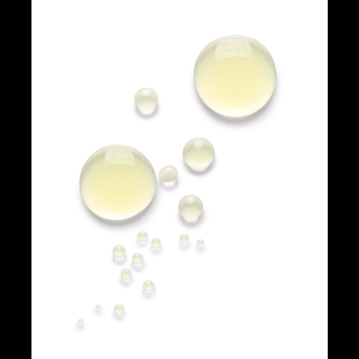 Klorane Stretch Mark Oil, pale yellow oil droplets on a white background