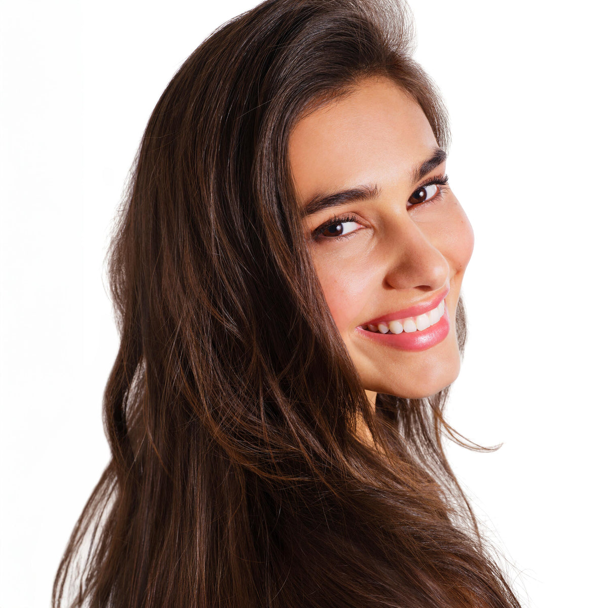 Klorane Nettle Tinted Dry Shampoo, smiling woman with long brown hair looking over her shoulder