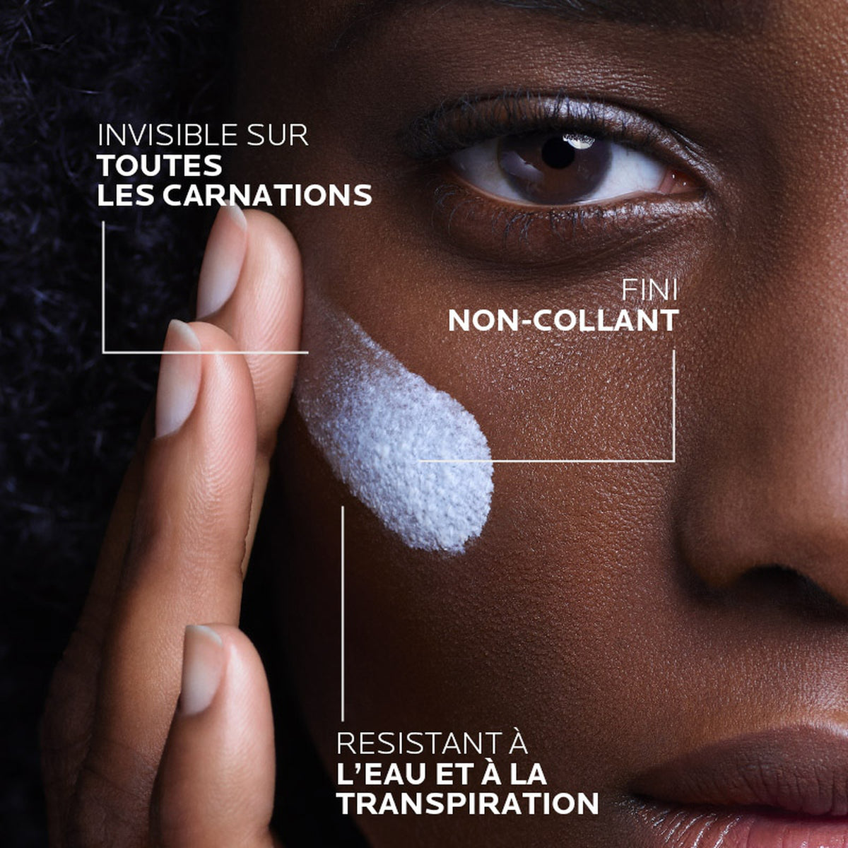 Anthelios UVMUNE 400 fluid applied to the cheek, leaving an invisible non-sticky finish