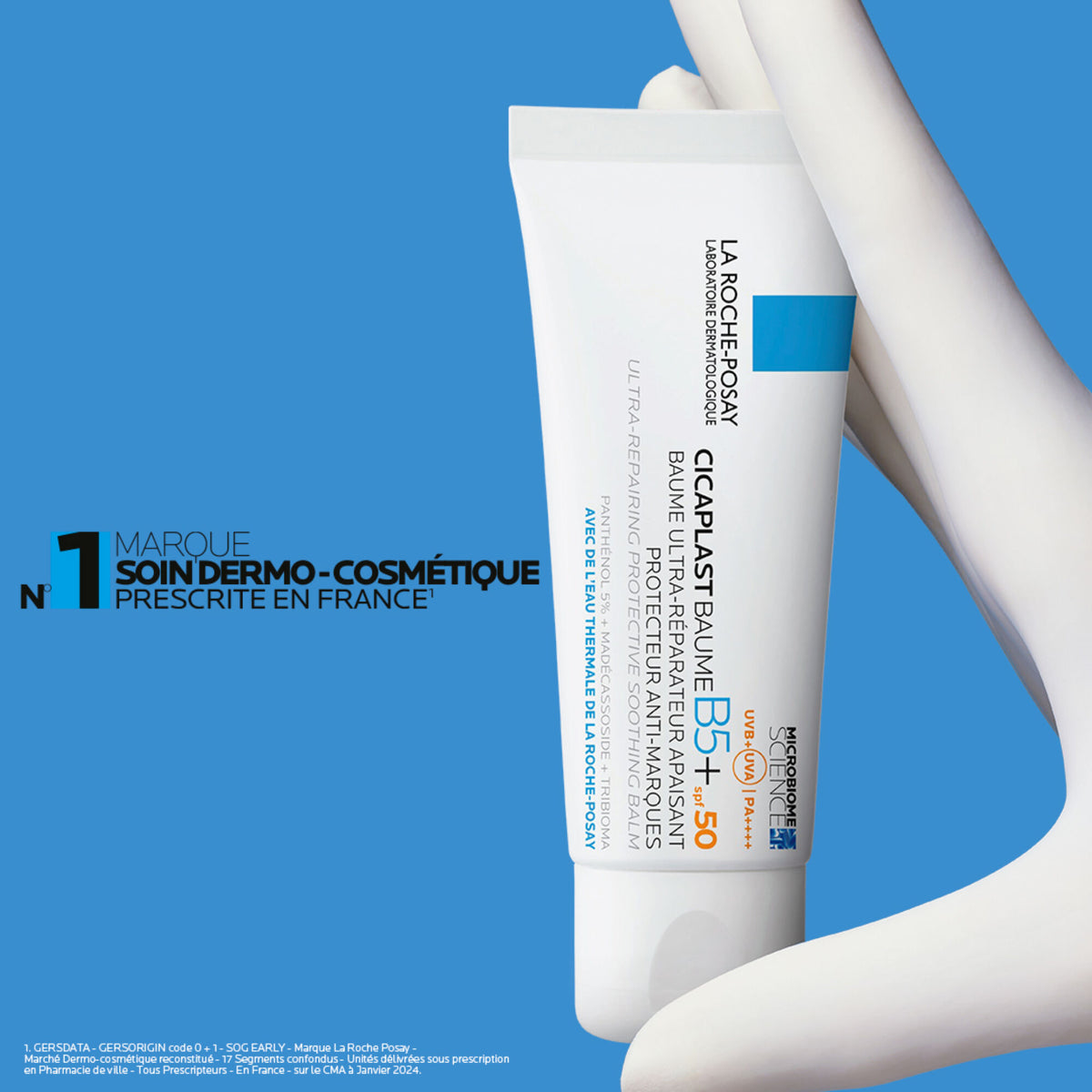La Roche-Posay Cicaplast, gloved hand holding the tube on a blue background