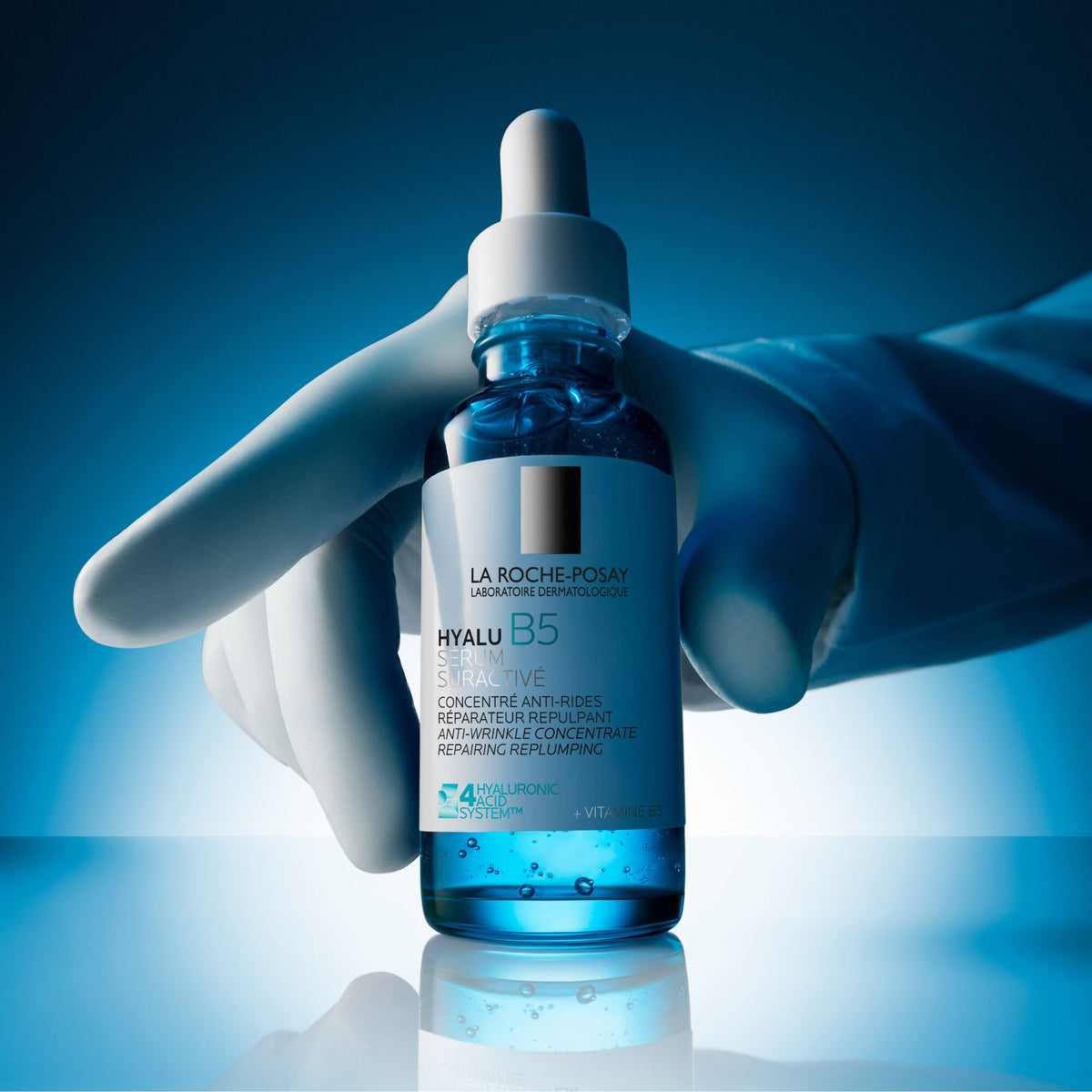 La Roche-Posay Hyalu B5, gloved hand holding the glass bottle