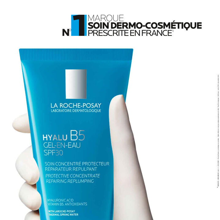 La Roche-Posay Hyalu B5, gloved hand holding the tube