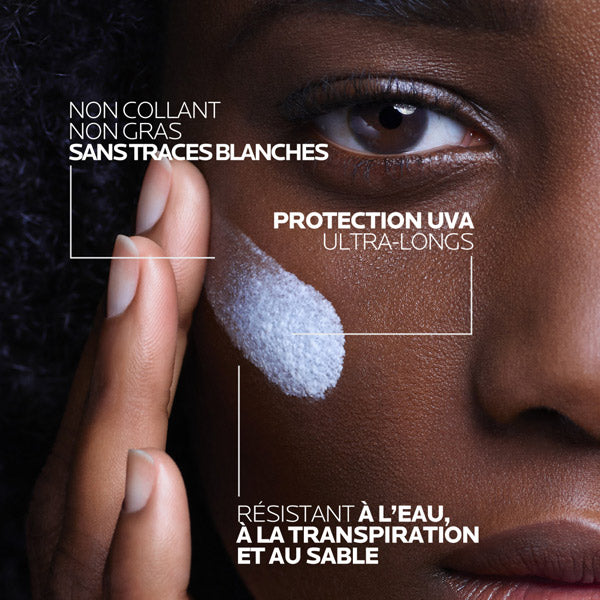 La Roche-Posay Anthelios UVmune 400, applied to the face with callouts in French