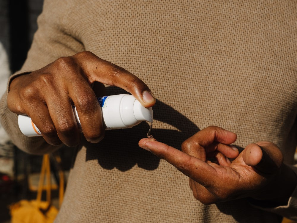 Mustela Arnica and Calendula Gel, gel pumped onto a fingertip