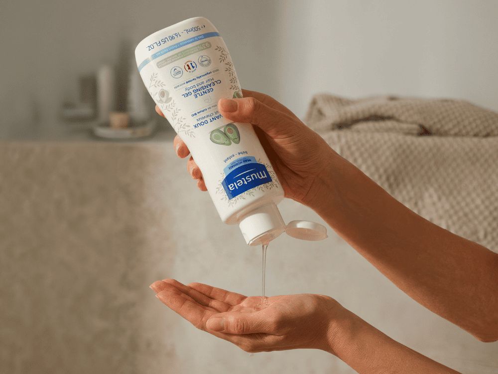 Mustela Body and Hair Wash, gel poured into a palm
