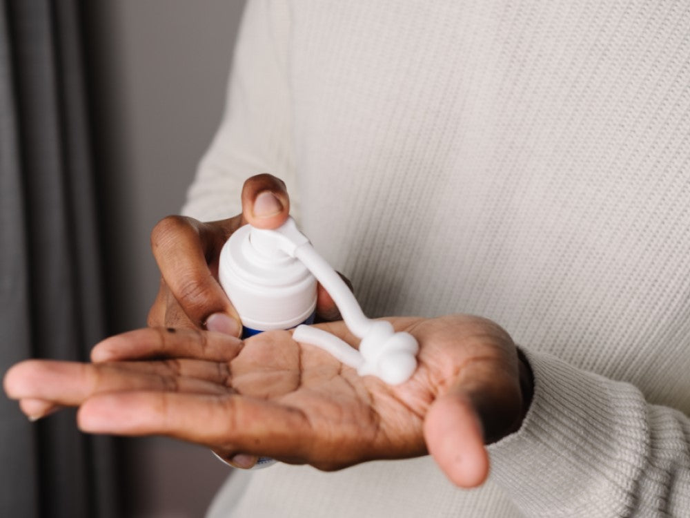 Mustela Baby Foam Shampoo, hand pumping foam into the palm