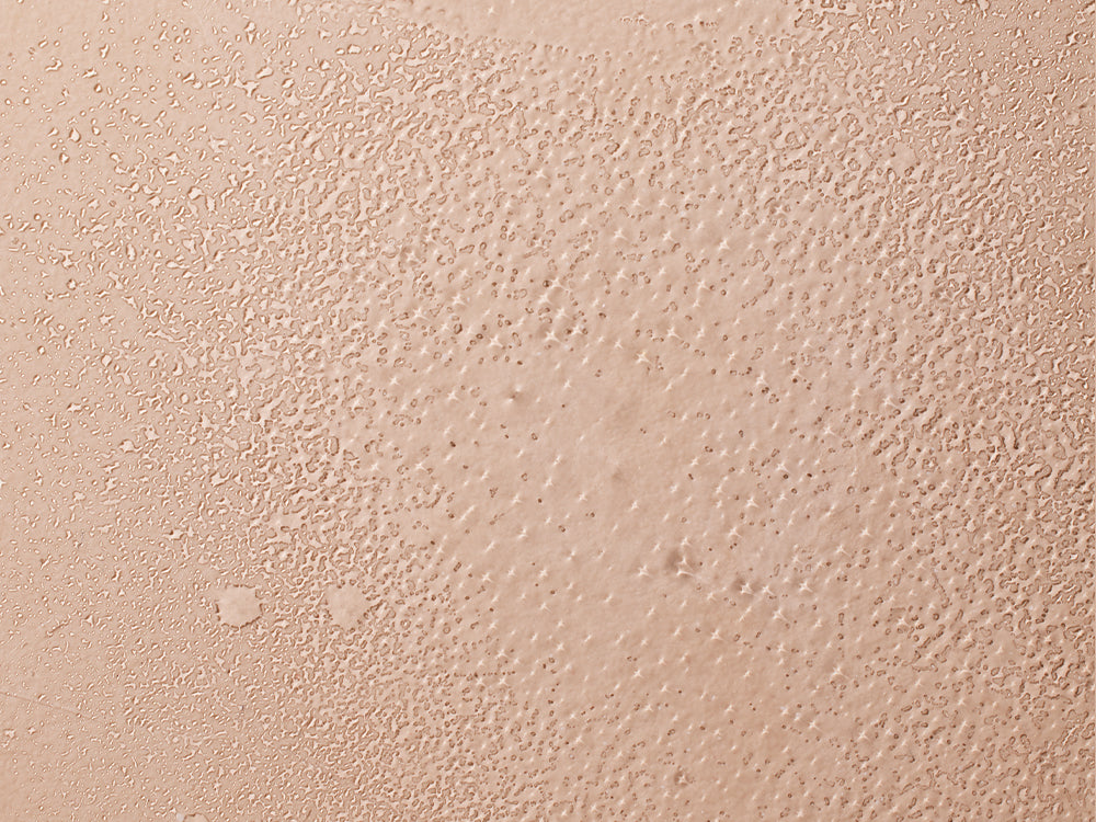 Mustela Refreshing and Styling Water, mist texture swatch