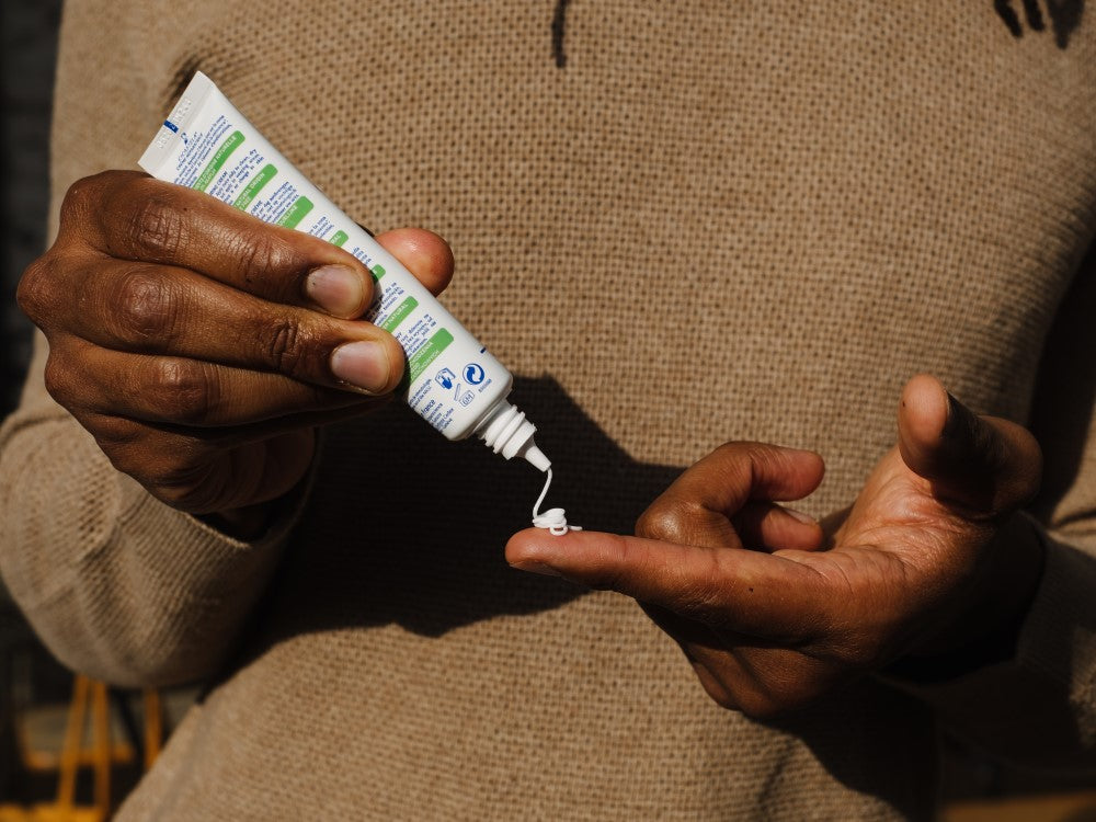 Mustela Cicastela, cream squeezed from the tube onto a fingertip