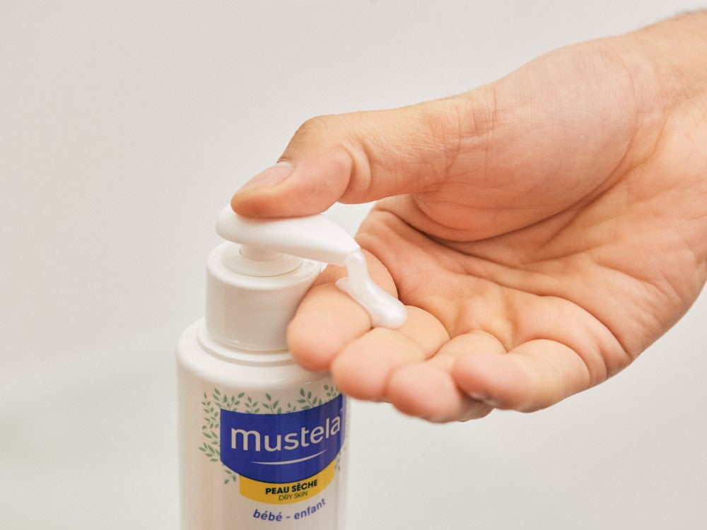 Mustela Cold Cream, gel pumped from the bottle into a hand